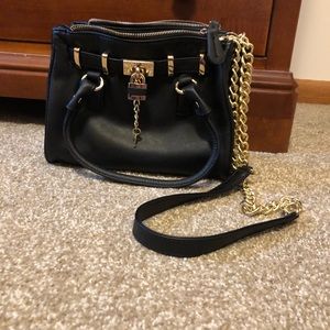 Black handbag with gold hardware